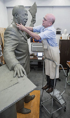 Brad Vanneman working on sculpture of Dr. Jerome H. Holland